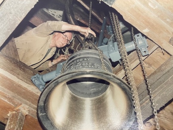 A church bell being hung in a tower